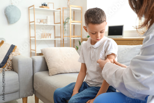 Doctor putting plaster on l...