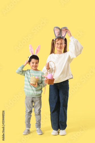 Little children in bunny ea...