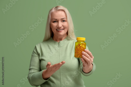 Mature woman showing bottle...