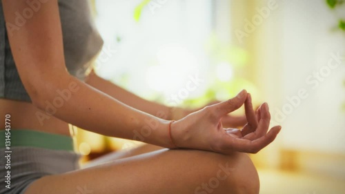 Wallpaper Mural A person sits cross-legged, engaging in meditation to cultivate mindfulness and relaxation. Natural light enters the room, enhancing the peaceful atmosphere Torontodigital.ca