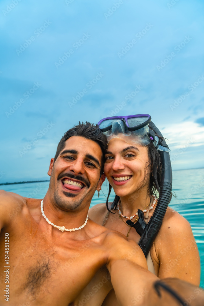 Tourists taking selfie while snorkeling in cebu, philippines Tourists taking selfie while snorkeling in cebu, philippines
