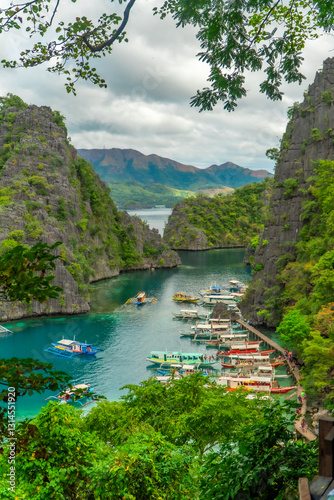 Tourists visiting kayangan lake in coron island, philippines, enjoying tropical scenery