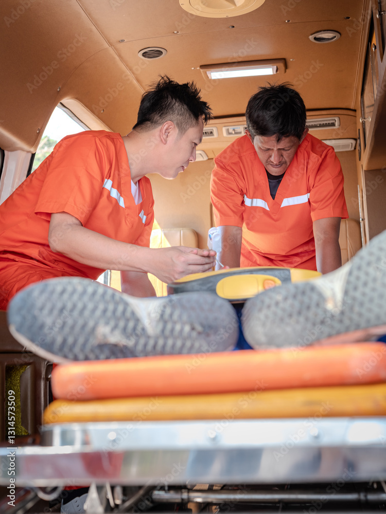 Emergency Care Assistant Putting Connects Finger Heart Rate Monitor in an Ambulance car .