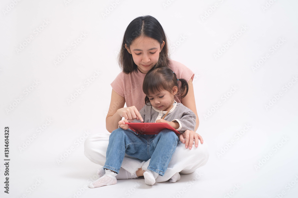 Mother and daughter sitting together with a tablet in a light setting, showcasing modern family bonding through technology and shared learning. Mother and daughter sitting together with a tablet in a light setting, showcasing modern family bonding through technology and shared learning.