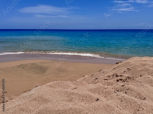 landscape of a sandy beach in Guadeloupe in the French West Indies with a view of the turquoise blue Caribbean Sea
 photo