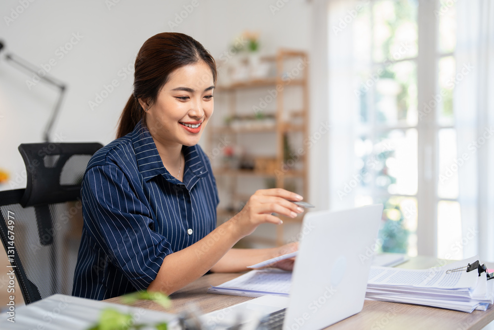 Young busy business woman manager sme entrepreneur holding pen and accounting bookkeeping documents checking financial data or marketing report working at home with laptop. Paperwork management Young busy business woman manager sme entrepreneur holding pen and accounting bookkeeping documents checking financial data or marketing report working at home with laptop. Paperwork management