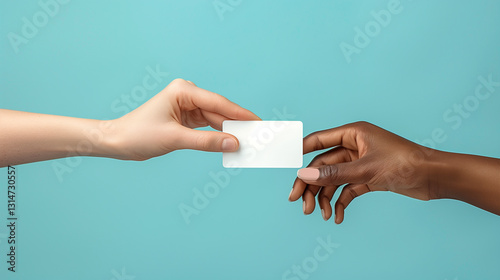 close-up of a business card for your text in the hands of two people of different races.