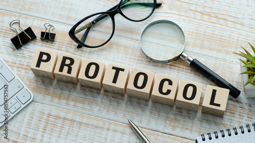 A wooden block with the word protocol written on it
