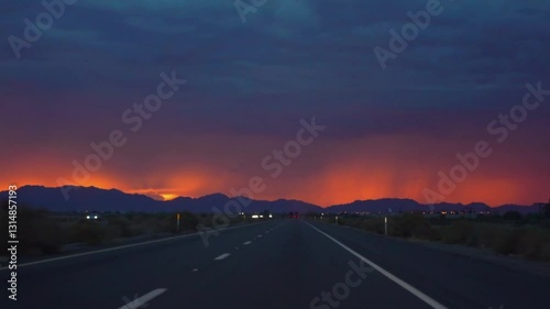 Driving on a road to Yuma, Arizona with a vibrant sunset in slow motion 120fps