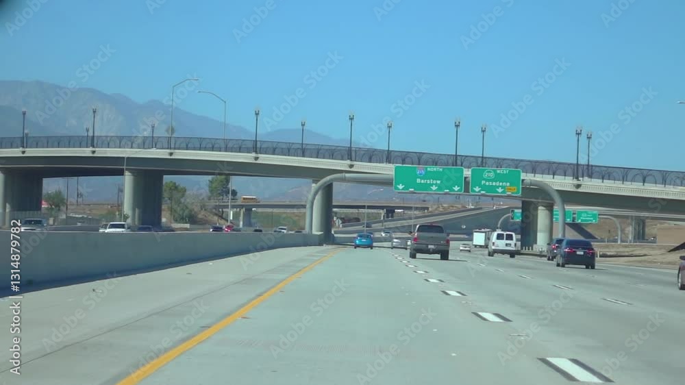 Vehicles traveling on a highway through hilly terrain in Nevada in slow motion 250fps Vehicles traveling on a highway through hilly terrain in Nevada in slow motion 250fps