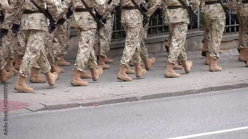 Soldiers marching on a sidewalk during a parade in slow motion 120fps