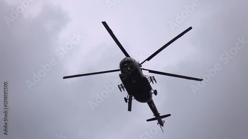Group of helicopters soaring in the sky together
