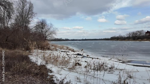 Wallpaper Mural slow motion video winter landscape on frozen lake. cracked ice on river. Bird watching in the wild. Slow motion video in 4k. Hand held video of lake shore frost winter cold wether Torontodigital.ca