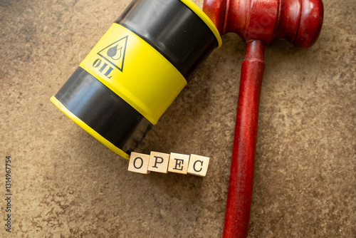 Oil barrel miniature next to opec text law