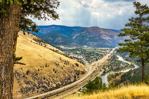 Obraz na płótnie Aerial view of I90 highway and East Missoula, Montana as viewed from Sentinel mountain. Missoula is a city in and the county seat of Missoula County, Montana. It is located along the Clark Fork River. w salonie