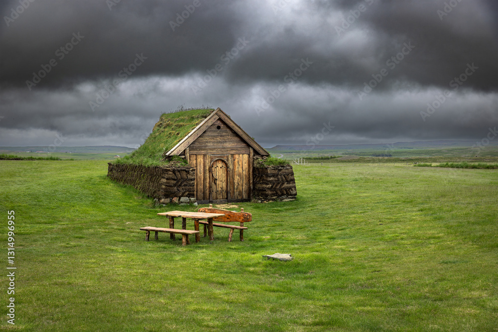 Fototapeta premium church house with grass roof in iceland cloudy sky
