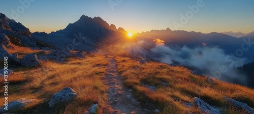 Fototapeta Naklejka Na Ścianę i Meble -  Golden hour light illuminating hiking path and panoramic view of tatra mountains with clouds at sunrise in poland