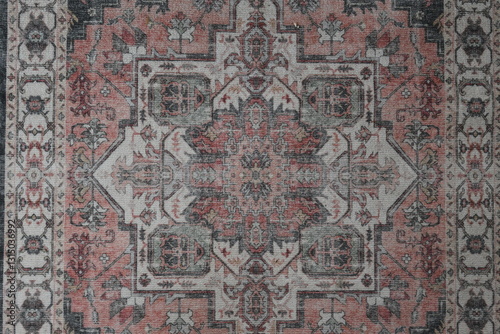 A rug with a pattern of red and gray