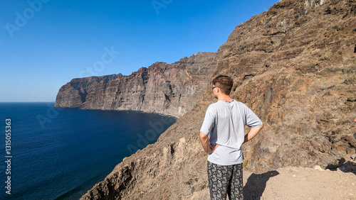 Wallpaper Mural Tourist on background of giant cliffs Los Gigantes. Canary Islands. Spain. Atlantic Ocean. Torontodigital.ca