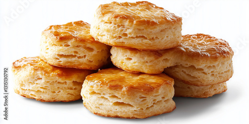 Buttermilk biscuits golden-brown, rising tall with homemade flaky layers and buttery appeal isolated on a white background