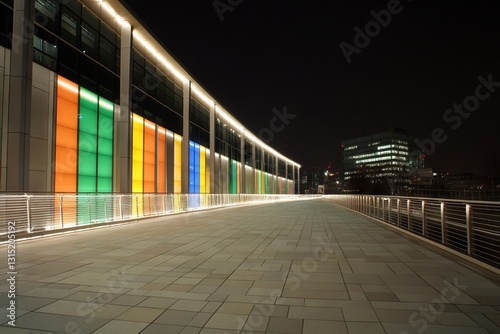 Colorful modern building walkway at night photo