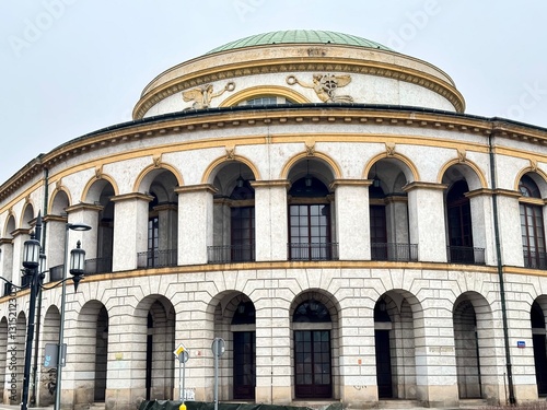 view of an old building with historical architecture with a dome on a Warsaw street on a cloudy winter day

