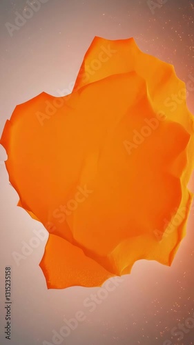 Bright orange liquid paint spreading smoothly on light background, creating abstract flowing patterns with organic movement. Perfect for creative and artistic concepts with copy space.