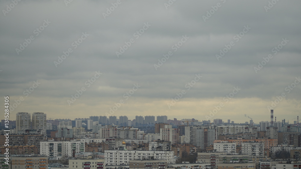 Moody city panorama shrouded in clouds. Diffused light creates mysterious atmosphere, highlighting architectural silhouettes. Perfect for urban ambiance, travel and cityscape projects Moody city panorama shrouded in clouds. Diffused light creates mysterious atmosphere, highlighting architectural silhouettes. Perfect for urban ambiance, travel and cityscape projects