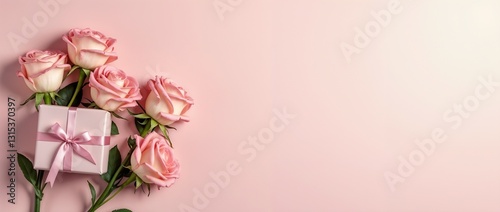 An arrangement of light pink roses and a small pink gift box with a ribbon, resting on a pink pastel background, evoking themes of love, celebration, and romantic gestures.