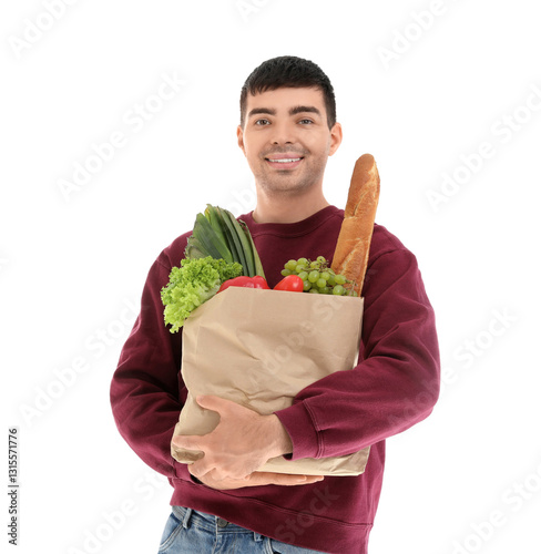 Smiling young man holding a...