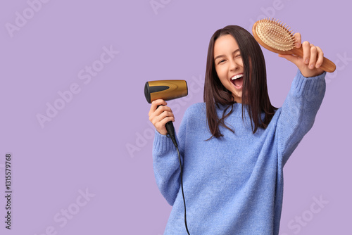 Happy young woman with hair...