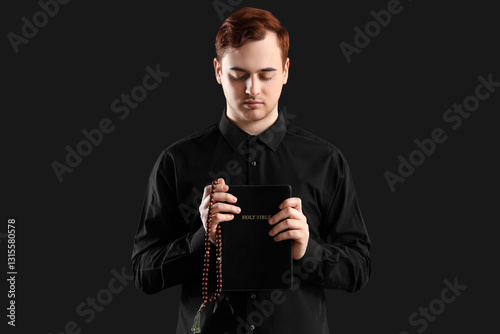 Young man with Holy Bible a...