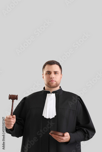 Male judge with gavel on li...