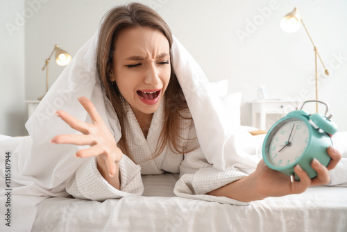 Angry young woman with alar...