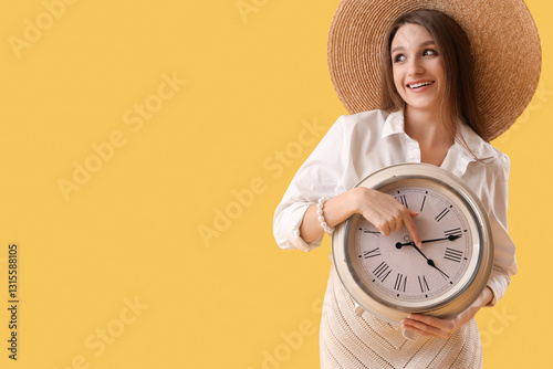 Young woman with clock on y...