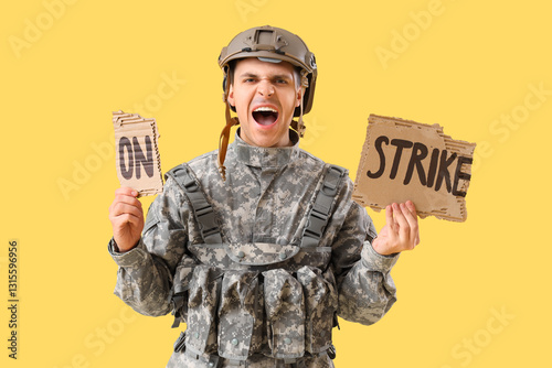 Protesting male soldier hol...