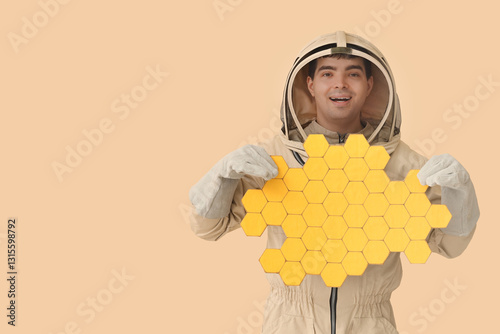 Male beekeeper with paper h...