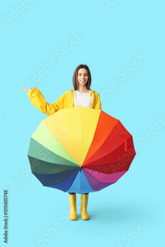 Young happy woman in rainco...