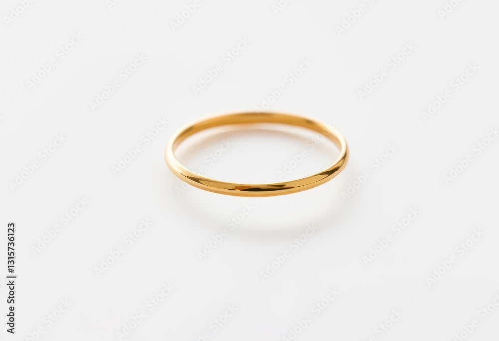 Delicate, thin gold band ring on pristine white background, photography, delicate Delicate, thin gold band ring on pristine white background, photography, delicate