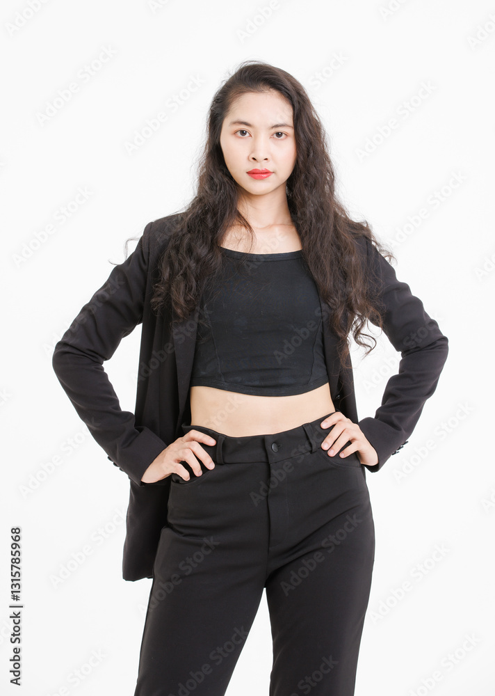 Portrait of asian beautiful woman curly long hair, wearing black suit, black long pants, model girl positive attractive confident charming, standing pose look at camera on white background in studio. Portrait of asian beautiful woman curly long hair, wearing black suit, black long pants, model girl positive attractive confident charming, standing pose look at camera on white background in studio.