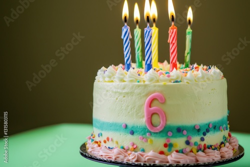 Green soft background, vibrant cake with 6 candles, text room.