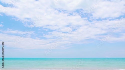 Wide Angle View of Tranquil Ocean Waves Under Bright Blue Sky with Soft White Clouds on a Sunny Day at a Serene Beach