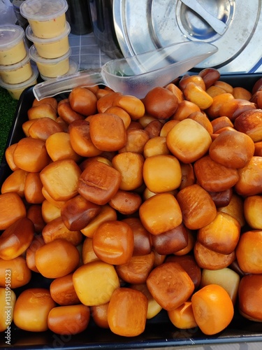 Vendor selling cuisine at street bazaar in Malaysia catered for iftar during Muslim fasting month of Ramadan
