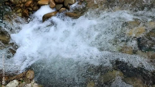 Stunning slow-motion footage of water gracefully tumbling from rocky cliffs