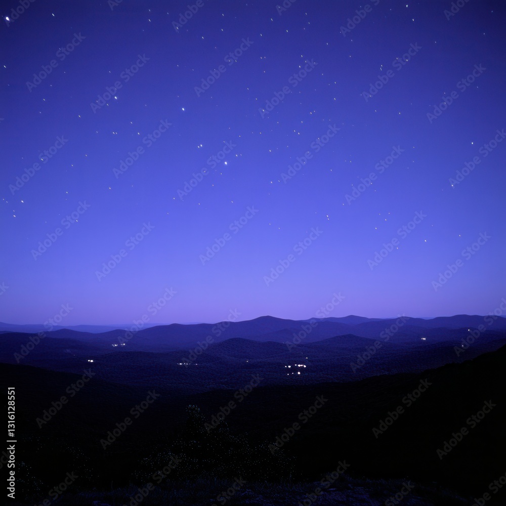 Serene nightscape of mountain range under a star studded sky capturing distant lights and tranquil atmosphere with a dark foreground Serene nightscape of mountain range under a star studded sky capturing distant lights and tranquil atmosphere with a dark foreground