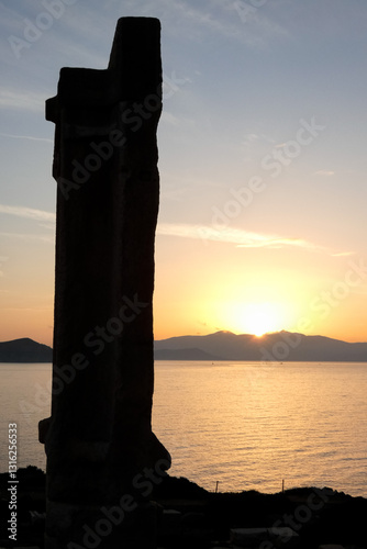 Portara of naxos overlooking the aegean sea and naxos town at sunset photo