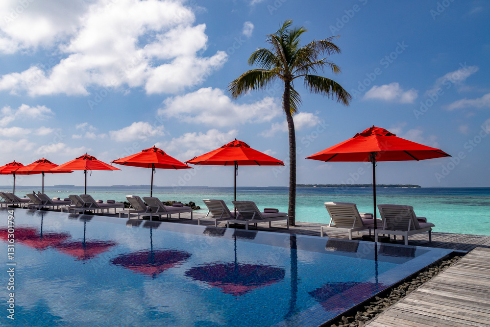 Luxurious resort in the Maldives with swimming pool and parasols and sun loungers Luxurious resort in the Maldives with swimming pool and parasols and sun loungers