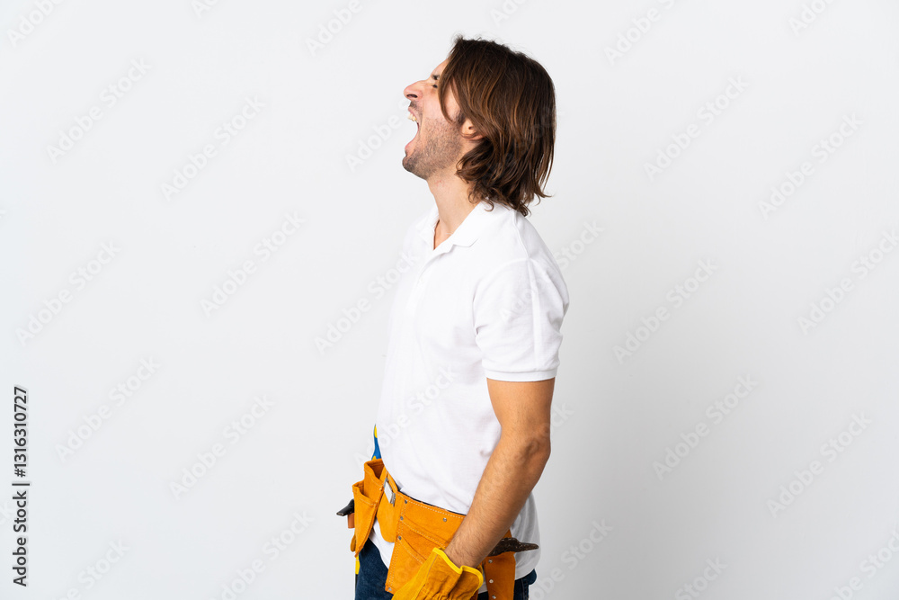 Young electrician man over isolated background laughing in lateral position Young electrician man over isolated background laughing in lateral position