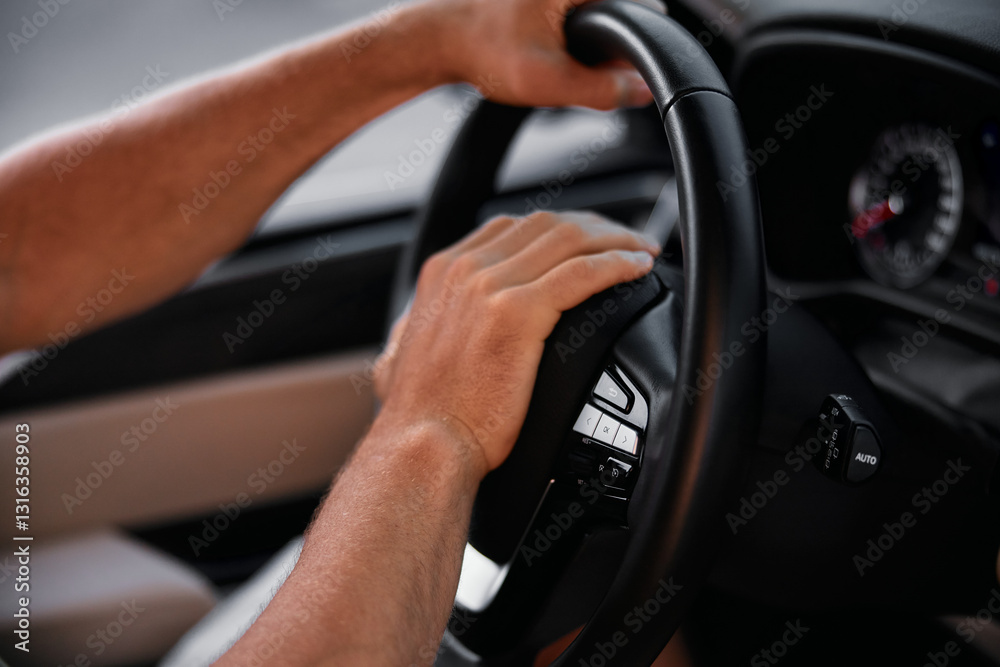 Close up of hands gripping a car steering wheel while driving in a modern vehicle The dashboard and speedometer are visible in the background