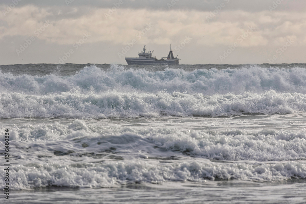 Fishing boat during a storm on the ocean
